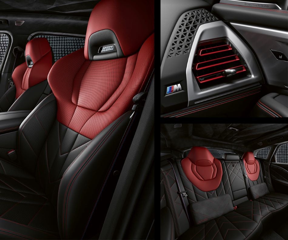 Detail of front seats, clad in exclusive BMW Individual Fiona Red & Black Merino Leather with exclusive M Signature Trim and red stitching and accents. Detail of red accented vent. Detail of rear M Lounge with exclusive XM pillows in Leith BMW | Raleigh NC